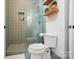 Bathroom with a shower with green tiling and a toilet at 6508 Trenton Pl, Charlotte, NC 28226