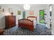 Bedroom with wood furniture, large windows and decor at 6508 Trenton Pl, Charlotte, NC 28226