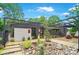 Stunning exterior boasts modern architecture, stylish landscaping, and inviting entrance, creating exceptional curb appeal at 6508 Trenton Pl, Charlotte, NC 28226