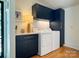 Functional laundry room equipped with modern appliances, ample cabinet space, and stylish design for efficient chores at 6508 Trenton Pl, Charlotte, NC 28226