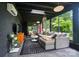 Inviting living room features modern decor, stylish furniture, and floor-to-ceiling windows with views of the lush landscape at 6508 Trenton Pl, Charlotte, NC 28226
