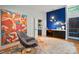 A stylish office space with colorful decor, a large painting, hardwood floors, and a well-lit workstation at 6508 Trenton Pl, Charlotte, NC 28226