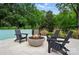 Cozy pool area with fire pit, perfect for outdoor gatherings at 6508 Trenton Pl, Charlotte, NC 28226