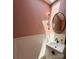 Stylish powder room features a unique sink, modern fixtures, and tasteful decor, enhancing the home's elegance at 6508 Trenton Pl, Charlotte, NC 28226
