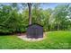 Modern shed surrounded by stone and greenery at 6508 Trenton Pl, Charlotte, NC 28226