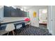 Study featuring an extended desk, stylish cabinets, and quirky decor at 6508 Trenton Pl, Charlotte, NC 28226