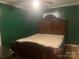 Cozy bedroom featuring a ceiling fan and a decorative headboard at 734 Harris Nw St, Concord, NC 28025