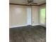 Another view of the living room showcasing luxury vinyl plank flooring and access to the backyard at 734 Harris Nw St, Concord, NC 28025