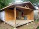New outbuilding construction with exposed studs and wood deck at 734 Harris Nw St, Concord, NC 28025