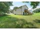 Spacious backyard with a deck accessible by wooden stairs at 809 Fisher St, Kannapolis, NC 28027