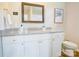 Bathroom featuring white cabinetry, granite countertops, and modern fixtures at 809 Fisher St, Kannapolis, NC 28027