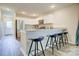 Modern kitchen with white cabinets, granite countertops, stainless steel appliances, and a breakfast bar with stylish stools at 809 Fisher St, Kannapolis, NC 28027