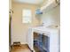 Laundry room features stacked washer and dryer and shelving at 809 Fisher St, Kannapolis, NC 28027
