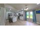 Open-concept kitchen with a breakfast bar, stainless steel appliances and generous natural light at 8140 Karriker Rd, Kannapolis, NC 28081
