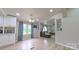 Bright open living area featuring natural light and wood-look flooring and grey paint at 8140 Karriker Rd, Kannapolis, NC 28081