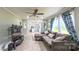 Inviting living room with luxury vinyl plank flooring flowing into adjacent open kitchen space at 8140 Karriker Rd, Kannapolis, NC 28081