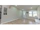 Well-lit living room featuring fresh paint and durable flooring at 8140 Karriker Rd, Kannapolis, NC 28081