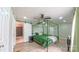 Comfortable bedroom featuring a modern canopy bed frame, luxury vinyl plank flooring, and ceiling fan at 8140 Karriker Rd, Kannapolis, NC 28081