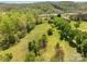 Picturesque aerial view of a vast, lush property, dotted with mature trees and open green spaces at 1046 Linneys Mill Rd, Union Grove, NC 28689