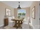 Elegant dining room with modern decor and a view from the window at 1046 Linneys Mill Rd, Union Grove, NC 28689