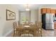 Bright dining room with a large table set for a meal, complemented by natural light and modern appliances at 1046 Linneys Mill Rd, Union Grove, NC 28689