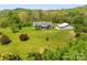 Expansive view of the beautiful home and surrounding acreage and outbuilding at 1046 Linneys Mill Rd, Union Grove, NC 28689