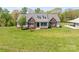 Charming home with brick accents, dormer windows, and a welcoming front porch at 1046 Linneys Mill Rd, Union Grove, NC 28689