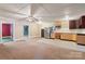 Open-concept living area with adjacent kitchen, ceiling fan, and colorful adjoining rooms at 1046 Linneys Mill Rd, Union Grove, NC 28689