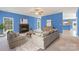 Cozy living room with a brick fireplace and neutral furnishings, offering a welcoming atmosphere at 1046 Linneys Mill Rd, Union Grove, NC 28689
