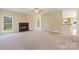 Spacious living room featuring a brick fireplace and large windows for natural light at 1046 Linneys Mill Rd, Union Grove, NC 28689