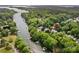 An aerial shot highlights a lakeside property with a pool, boat docks, and surrounding greenery at 110 Preserve Way, Mooresville, NC 28117