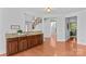 Bar area featuring granite counters and dark wood cabinets at 110 Preserve Way, Mooresville, NC 28117