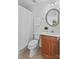 Bright bathroom featuring shower and vanity with wood cabinets at 110 Preserve Way, Mooresville, NC 28117