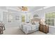 Bedroom features a tray ceiling, ceiling fan and bright windows at 110 Preserve Way, Mooresville, NC 28117