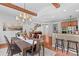 Open dining area with a view of staircase and kitchen, bathed in natural light at 110 Preserve Way, Mooresville, NC 28117