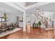 Elegant foyer with gleaming hardwood floors, a grand staircase, and an open layout, perfect for entertaining at 110 Preserve Way, Mooresville, NC 28117