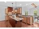 Bright kitchen featuring an island, granite countertops, and lots of cabinet space at 110 Preserve Way, Mooresville, NC 28117