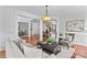 Inviting living room with hardwood floors, a view of the staircase, and seamless flow to the dining area at 110 Preserve Way, Mooresville, NC 28117