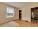 Bedroom with hardwood floors and a large window at 114 S 5Th St, Albemarle, NC 28001