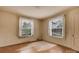 Bedroom with two windows letting in lots of natural light and hardwood floors at 114 S 5Th St, Albemarle, NC 28001