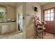 Functional laundry area with washer, dryer, and natural light at 114 S 5Th St, Albemarle, NC 28001