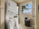 Convenient laundry room featuring stacked washer and dryer at 114 S 5Th St, Albemarle, NC 28001