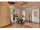 Living room with hardwood floors and multiple doorways leading to other rooms at 114 S 5Th St, Albemarle, NC 28001