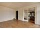 Open living area with hardwood floors and glass-paned doors leading to the dining room at 114 S 5Th St, Albemarle, NC 28001