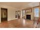 Spacious living room featuring hardwood floors and a decorative fireplace at 114 S 5Th St, Albemarle, NC 28001
