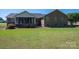 Large backyard with a screened porch offering a private outdoor living space and brick exterior at 118 Sir Gregory Dr, Shelby, NC 28152