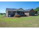 Spacious backyard featuring a screened porch area, ideal for outdoor relaxation and entertaining at 118 Sir Gregory Dr, Shelby, NC 28152