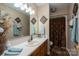 This bathroom features a vanity with storage, a mirror, and a shower with a curtain at 118 Sir Gregory Dr, Shelby, NC 28152