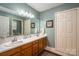 This bathroom features a double sink vanity with plenty of storage and large mirror at 118 Sir Gregory Dr, Shelby, NC 28152