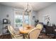 Comfortable dining room featuring a chandelier and lots of natural light at 118 Sir Gregory Dr, Shelby, NC 28152